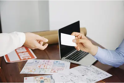 real-estate-workers-with-business-card-min SEAMLESS LOAN NEGOTIATION